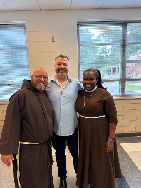 Francis X. Cunnane III (center) with Franciscan brothers and sisters